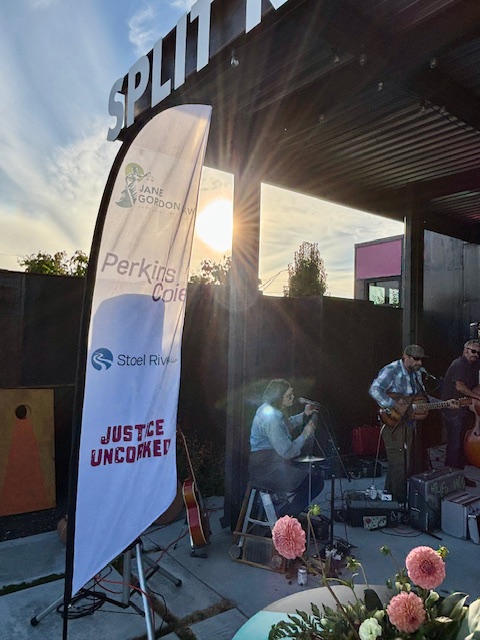 banner with sponsors and band outdoors