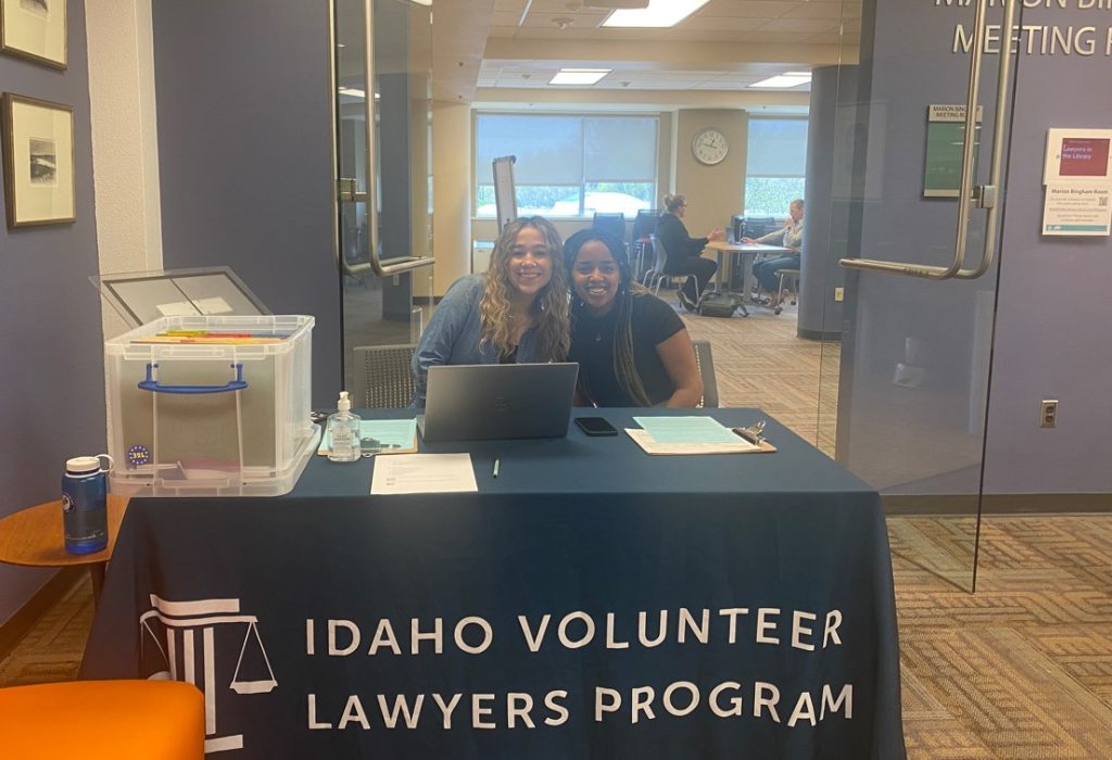 IVLP staff at table for check in to clinic.