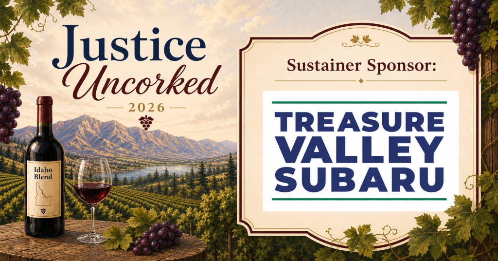 "Justice Uncorked 2026" event graphic with a vineyard and mountain landscape, a wine bottle labeled "Idaho Blend," and a glass of red wine. Text reads "Sustainer Sponsor: Treasure Valley Subaru."